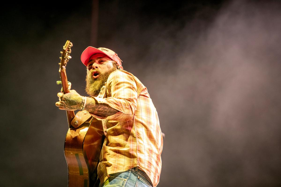 Post Malone reveals his love of country music, performs with Brad Paisley at Stagecoach
